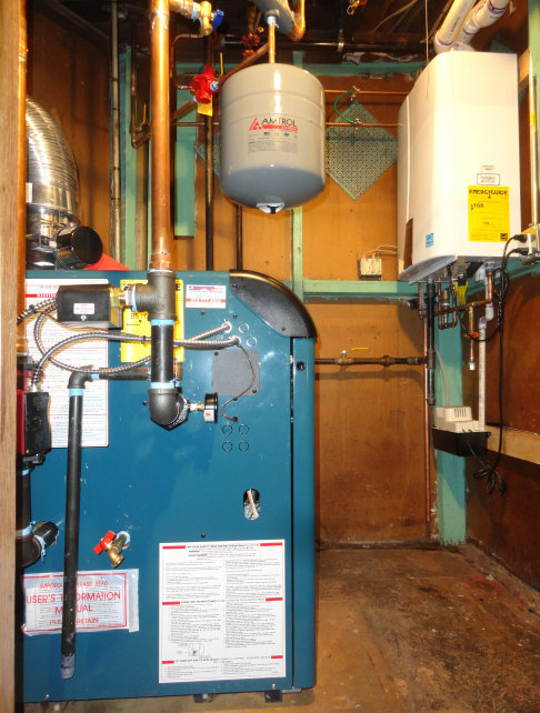 Pictured is a Burnham hot water boiler and a Navien hot water on demand installed for an oil to gas conversion in Clifton, NJ.